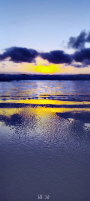 Sunset over the ocean with reflection