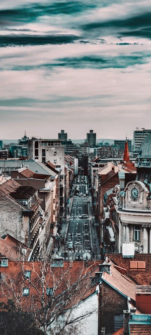 Cityscape with buildings and street traffic