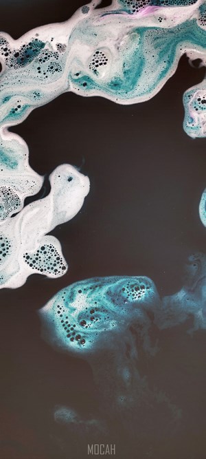 Abstract blue and white foam on black background