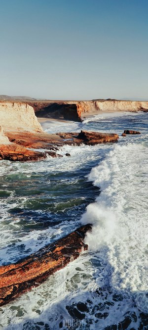 California Coastline with Waves Crashing on Rocks