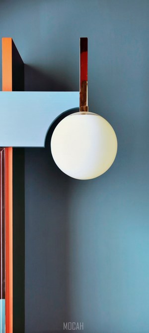 Abstract geometric sculpture with a globe light