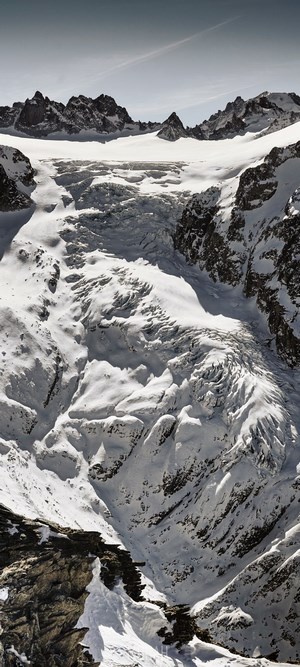 Snowy mountain range with a glacier