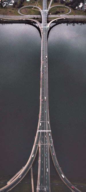 Aerial view of a multi-lane bridge over a body of water