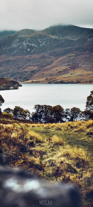 Tranquil Highland Lake and Rolling Hills