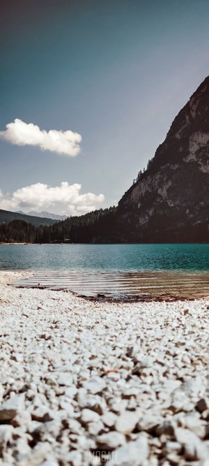 Lake with mountain and rocky shore