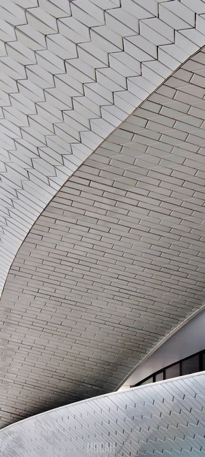 Abstract architectural detail of white tiled roof