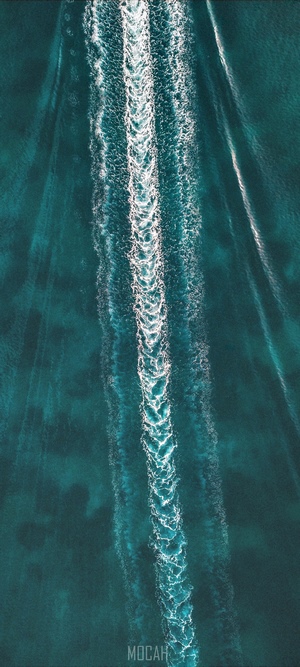 Aerial view of boat wake on turquoise water