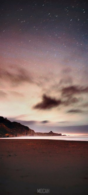 Beach landscape with stars and clouds at sunset