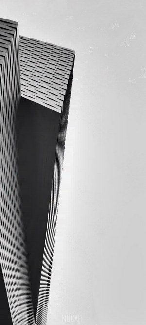 Modern building facade against a bright sky