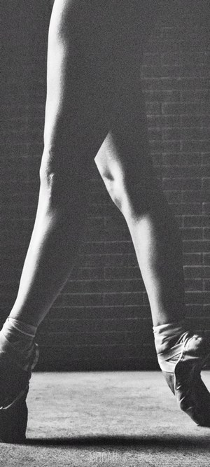 Ballet dancer's legs in pointe shoes