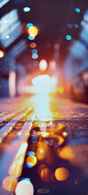 Bokeh lights on wet street at night