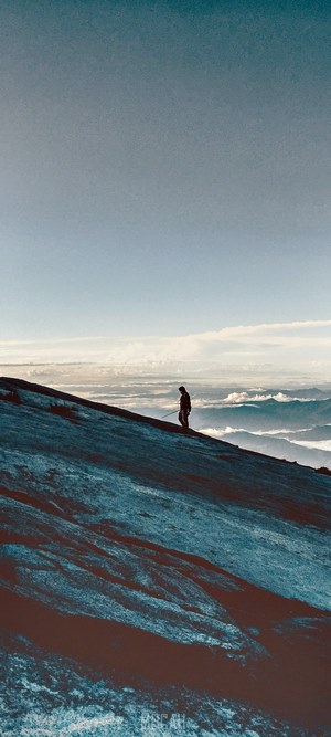 Person walking on a mountain slope