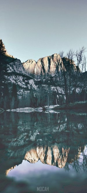 Mountain reflection in lake at sunrise