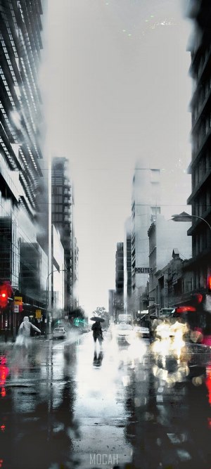 Rainy city street with reflections and people