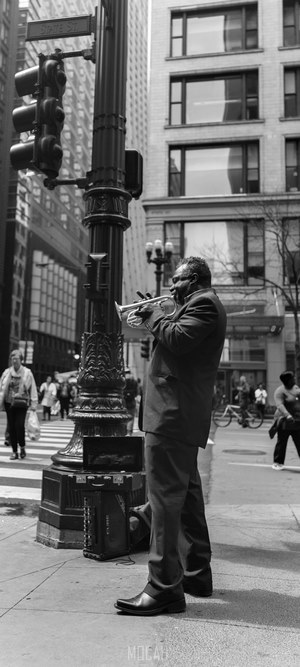 Musician playing trumpet on State Street, Chicago