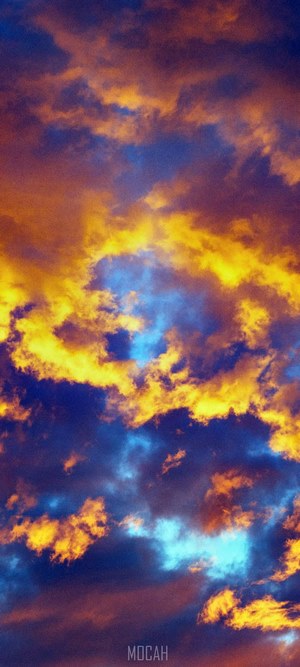 Dramatic sunset clouds with orange and blue hues