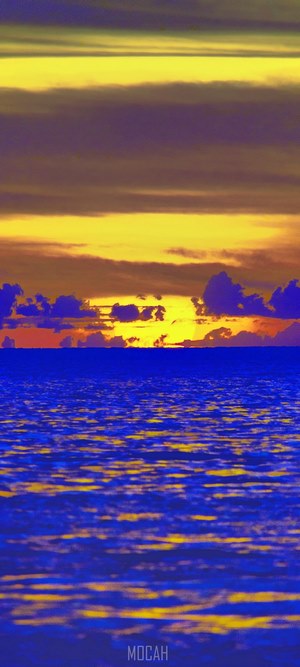 Sunset over the ocean with colorful clouds