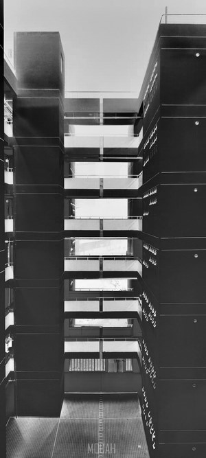 Modern brutalist architecture with balconies and windows