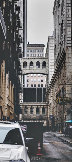 Alleyway between buildings with O'Malley's sign