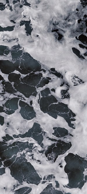 Abstract dark water with white foam