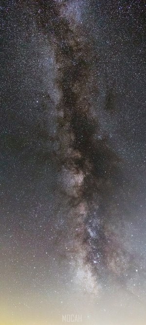 Milky Way galaxy rising above light pollution