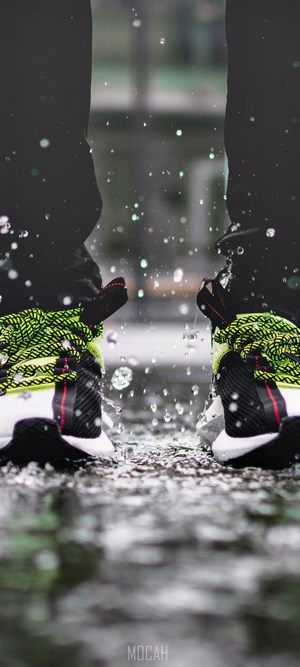 Sneakers splashing in water