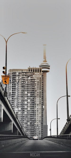 CN Tower and skyscraper viewed from a bridge