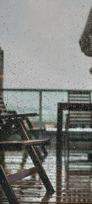 Balcony chairs on a rainy day