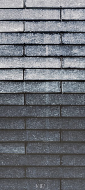 Gray brick wall texture with a watermark