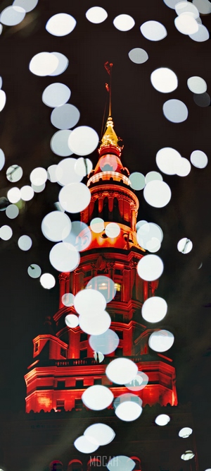 Red Tower at Night with Bokeh Lights