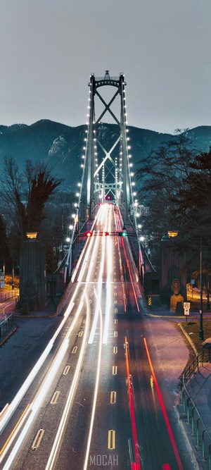 Lions Gate Bridge at night with light trails