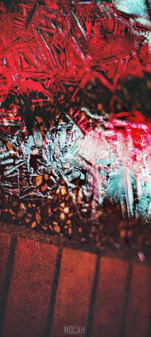 Abstract red and blue ice patterns on brick
