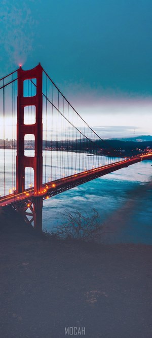Golden Gate Bridge at dusk with glowing lights