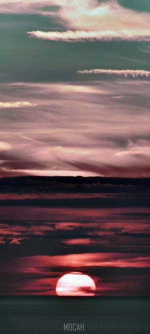 Sunset over the sea with clouds