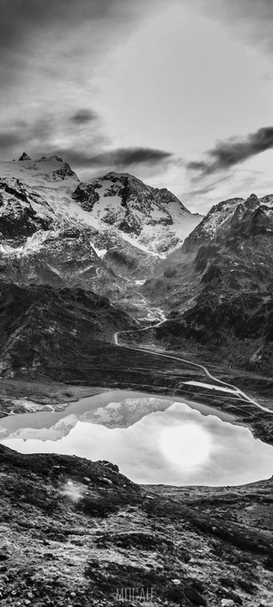 Snow-capped mountains reflected in a lake