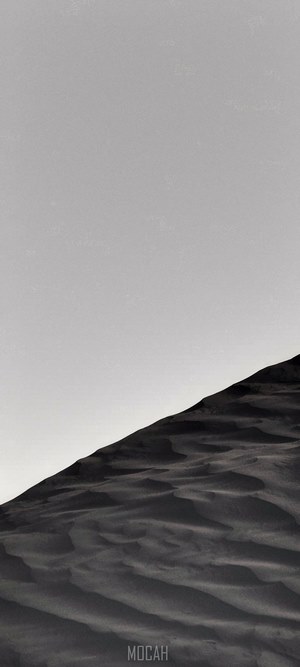 Sand dunes under a clear sky