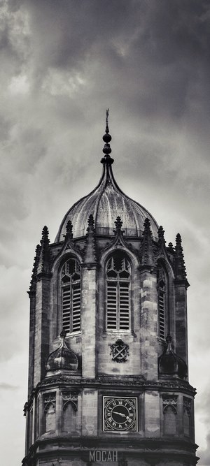 Tom Tower clock tower with stormy sky