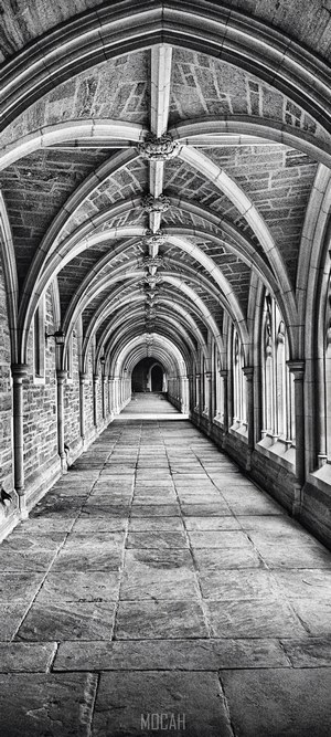 Classic stone arched hallway with Gothic architecture