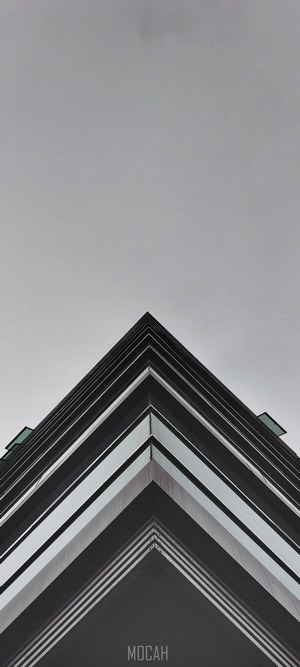 Building corner against a cloudy sky
