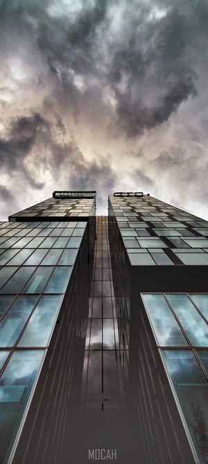 Modern skyscrapers under dark clouds