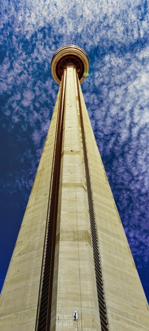 CN Tower against a cloudy blue sky