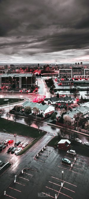 Cityscape with red lights on a rainy evening
