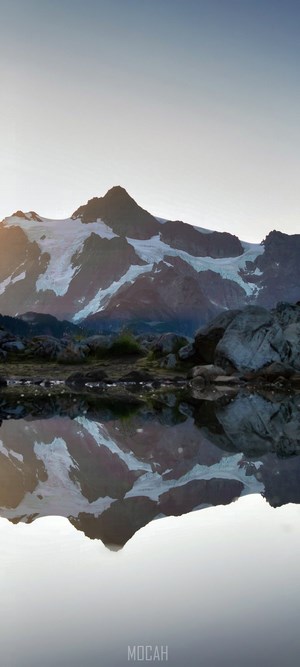 Mount Shuksan reflected in a calm mountain lake