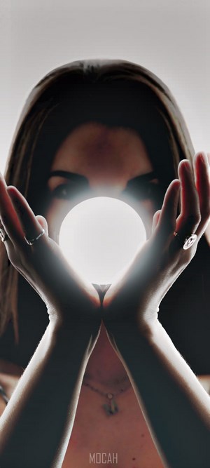 Woman holding a glowing orb