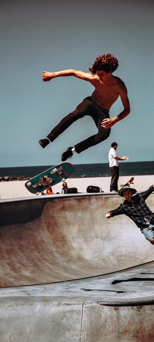Skateboarders performing tricks at a skatepark