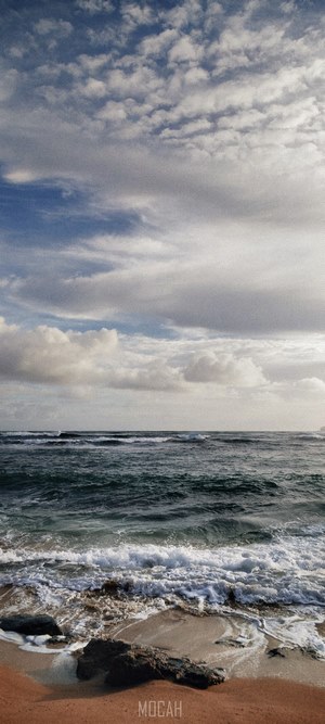 Calm Ocean Waves Under Cloudy Sky