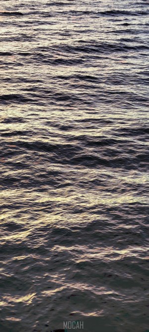 Water surface with orange reflections