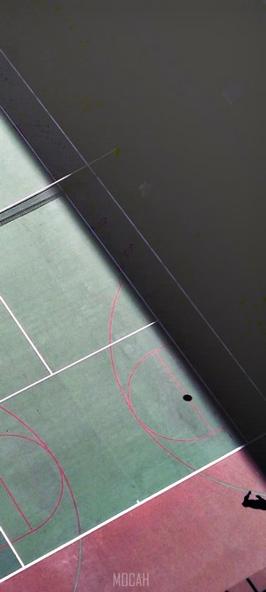 Basketball court with a shadow and a ball