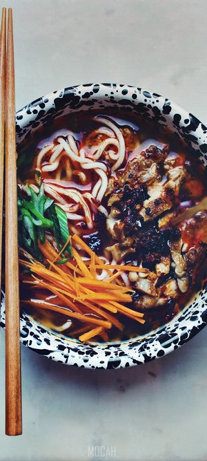 Bowl of noodles with chopsticks