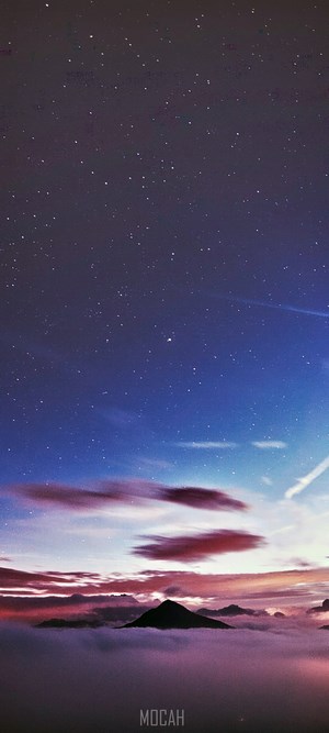 Starry Dusk Sky Over Mountain Peak Above Clouds